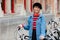 Girl with bicycle on street of Bruges