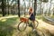 Girl on a bicycle in the woods