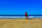 Girl on bicyle on beach