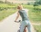 Girl on bike in countryside rear view