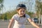 Girl with a bike in the park. 11 year old girl on a bicycle. Children`s sports and a healthy lifestyle