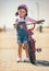 Girl, bike training and portrait, learning development and sports in street outdoor. Young child, bicycle safety with