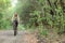 Girl biking in forest