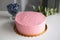 Girl birthday cream cheese pink cake. Simple mockup cake with blueberry on white table