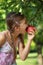 Girl biting into an apple