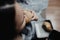 Girl biting a croissant and wearing a grey bath rope