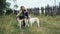 Girl in black dress with two Russian greyhounds