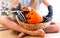 Girl in black gloves with bones sitting with basket full Pumpkins Halloween.