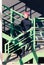 Girl in black standing on green ladder