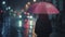 Girl in black wear in the dark rainy street with pink umbrella