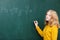 girl at the blackboard in a mathematics class