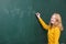 girl at the blackboard in a mathematics class