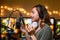 Girl blogger or radio host, working with a microphone, reading podcasts or news on the air. Homely and cozy atmosphere, work at