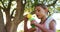 Girl blowing bubbles through bubble wand