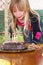 Girl blowing candles