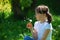 Girl blowing dandelion