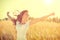 Girl with blowing hair enjoying nature