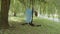 Girl in blue dress hanging on aerial silk