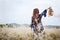 Girl in a blue dress on a wheat field. woman in meadow concept