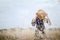 Girl in a blue dress on a wheat field. woman in meadow concept