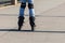 Girl in blue jeans rollerblading