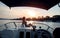 Girl on a boat, sunbathing on a front deck