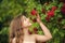 Girl botany garden red roses skin care, perfume fragrance concept