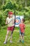 Girl and boy with bow near sport aim