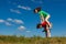 Girl and boy jumping outdoor