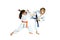 Girl and boy in karategi are training paired exercises karate