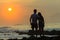 Girl Boy Silhouetted Beach Sunrise Ocean