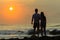 Girl Boy Silhouetted Beach Sunrise Ocean