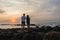 Girl Boy Silhouetted Beach Sunrise Ocean