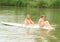 Girl and boy sitting on surf