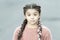 Girl with braided hair style with pink kanekalon. Hairdresser salon. Fancy look. Braided cutie. Little girl with cute