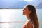 Girl breathes lake front. Portrait of beautiful woman enjoying yoga, relaxing, feeling alive, breathing fresh air, got freedom