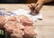 Girl bride signs invitations to wedding, in foreground delicate pink rose bouquet