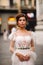 Girl-bride wedding dress with a beautiful floral pattern in Florence, stylish bride in a wedding dress stands in the Old city of