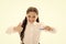 Girl brilliant perfect smile holds toothbrush with drop of paste white background. Child holds toothbrush and shows