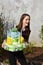 Girl brings birthday cake made of toilet paper