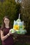 Girl brings birthday cake made of toilet paper