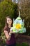 Girl brings birthday cake made of toilet paper