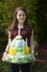 Girl brings birthday cake made of toilet paper