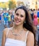 Girl brunette in white dress on holiday in city