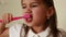 A girl brushes her teeth with a toothbrush . Care for the oral cavity. Baby close-up