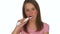 Girl Brushing Teeth Using Electric Toothbrush