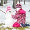 Girl building a snowman