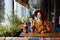 Girl in a cafe with a cup of coffee and a hat.portrait of sensual young girl wearing floppy hat and blouse with bow