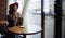 Girl in a cafe with a cup of coffee and a hat.portrait of sensual young girl wearing floppy hat and blouse with bow. Beautiful