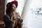 Girl in a cafe with a cup of coffee and a hat.portrait of sensual young girl wearing floppy hat and blouse with bow. Beautiful